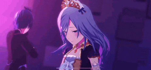 a man and a woman are standing next to each other in a dark room . the woman is wearing a tiara .