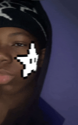 a close up of a person 's face with a pixelated arrow on it