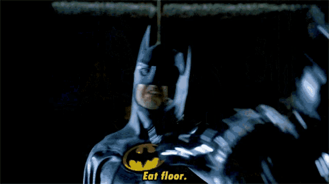 a woman in a white dress says " eat floor " in a dark room