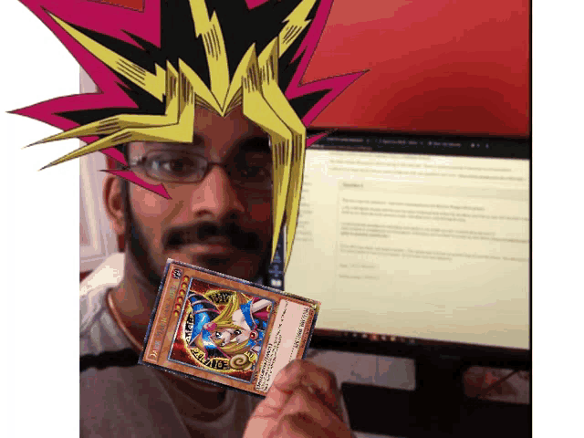 a man holding a yu gi oh card in front of a computer screen