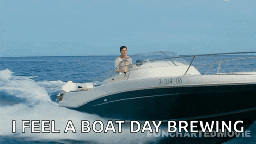 a man is driving a boat with the number 3-34-06 on the side