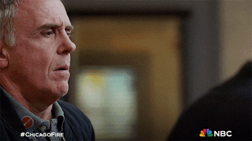 a close up of a man 's face with #chicagofire written on the bottom right