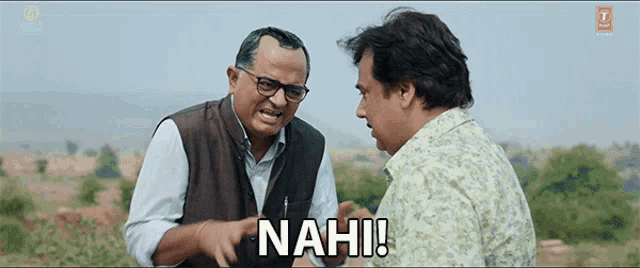 two men are talking to each other and one of them is saying nah !