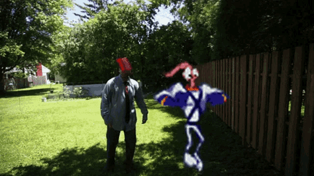 a man in a suit and tie is standing in a yard with a drawing of a worm on the grass