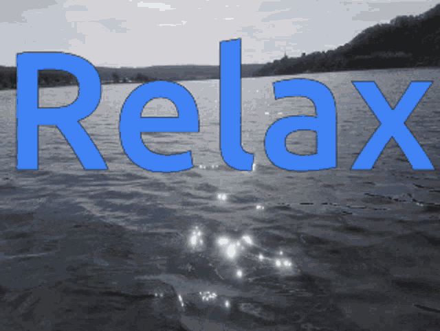 a picture of a lake with the word relax written on it