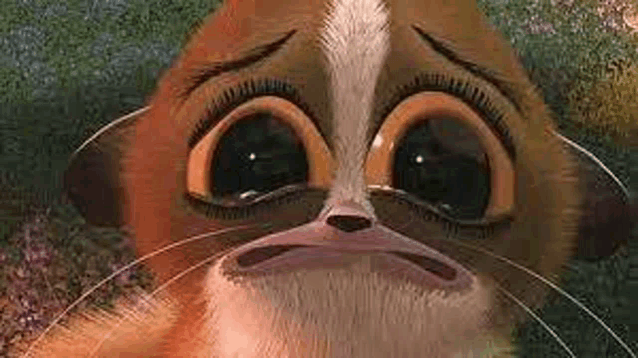 a close up of a cartoon cat 's face with a sad look on its face .