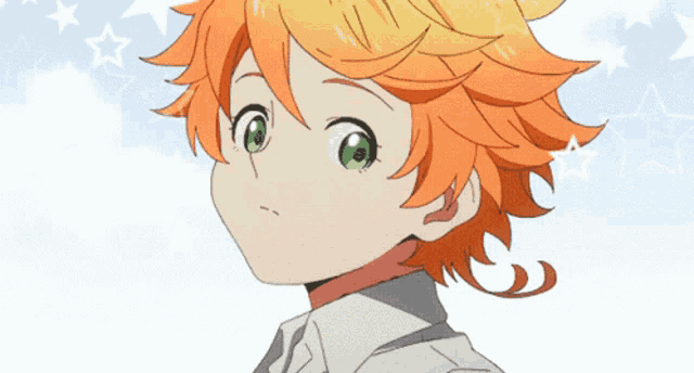 a girl with orange hair and green eyes is looking at the camera
