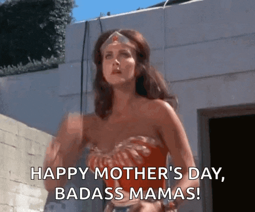 a woman in a wonder woman costume says happy mother 's day badass mamas !