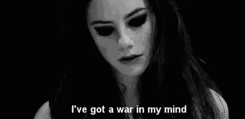 a black and white photo of a woman with the words `` i 've got a war in my mind '' written below her .