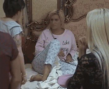 a woman in a pink sweater that says like honey