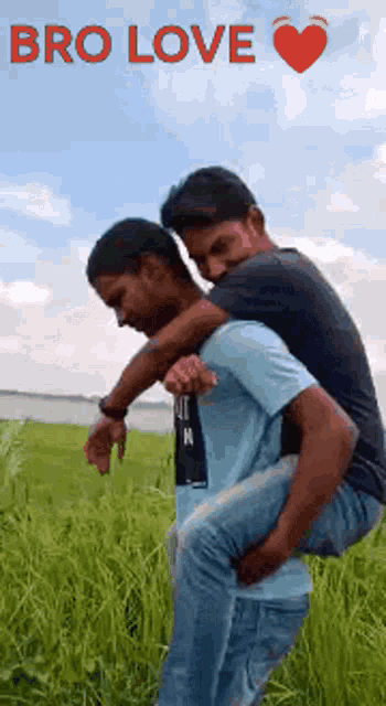 a man is carrying another man on his back in a field with the words bro love on the bottom