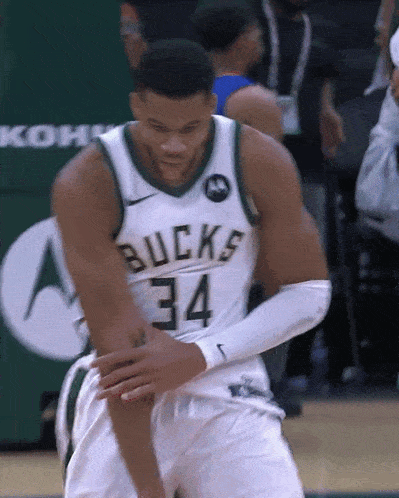 a basketball player wearing a bucks jersey number 34