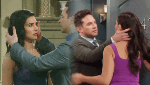 a woman in a purple dress is hugging a man in a suit in front of a door with the number 4 on it