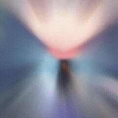 a blurry picture of a lamp on a table with a blue background .