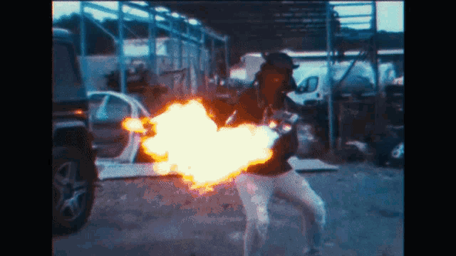 a person is holding a fireball in their hand