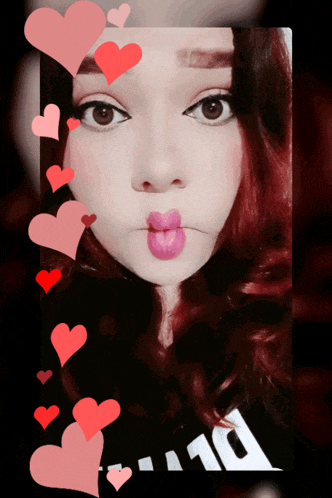 a girl with red hair is surrounded by hearts and has the number 10 written on her shirt