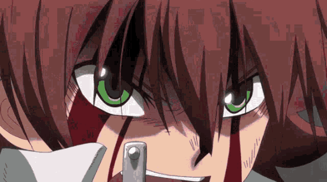 a close up of a person with green eyes and red hair