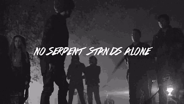 a black and white photo of a group of people with the words " no serpent stands alone " above them
