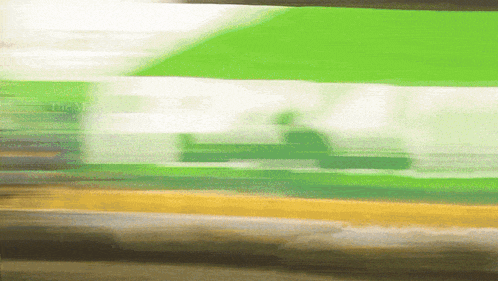 a blurred image of a green white and brown background