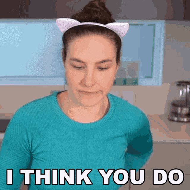 a woman wearing a cat ear headband with the words i think you do below her