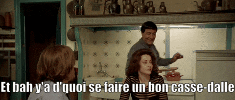 a man and woman in a kitchen with the words et bah y'a d' quoi se faire
