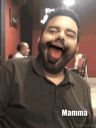 a man with a beard is making a funny face with mamma written on the bottom