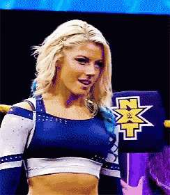 a blonde woman in a blue and white crop top with a x on it