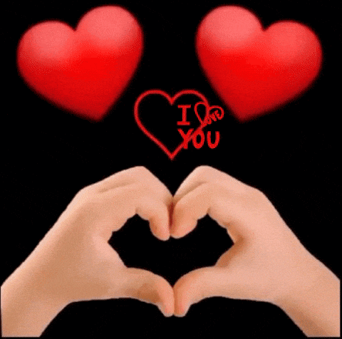 a person is making a heart shape with their hands in front of two red hearts that say i love you .