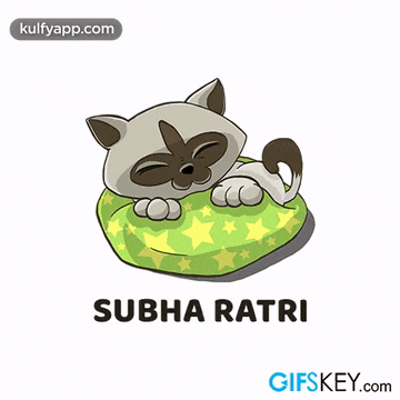 a cartoon cat is sleeping on a green pillow with stars on it