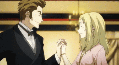 a man in a tuxedo and a woman in a pink dress are holding hands and dancing .