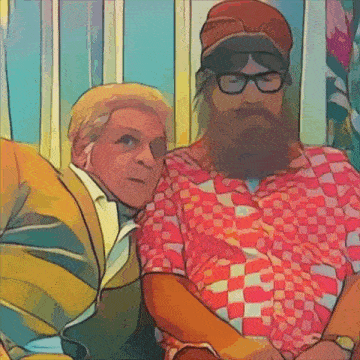 a man with glasses and a beard is sitting next to a woman