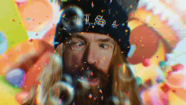a man with a beard wearing a hat that says u.s.