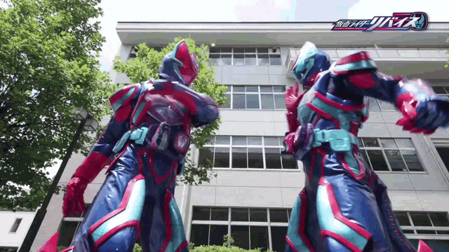two kamen riders are standing next to each other in front of a building ..