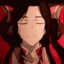 a close up of a cartoon character with his eyes closed and smiling .