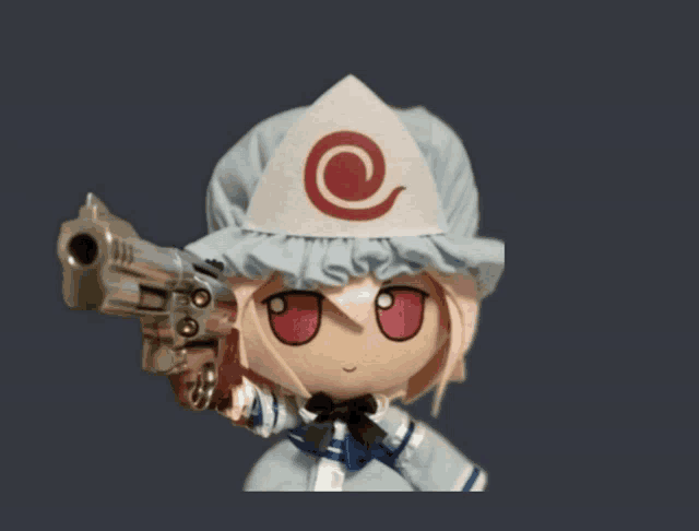 a doll with a white hat and a red swirl on it holds a gun