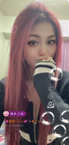 a woman with red hair has a purple sticker on her face that says id 671149479667
