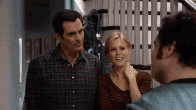 a man and a woman standing next to each other