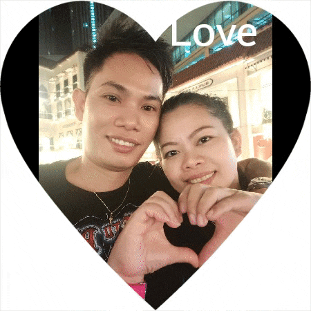 a man and a woman are making a heart with their hands