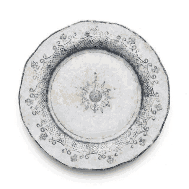 a white plate with a blue floral pattern on it