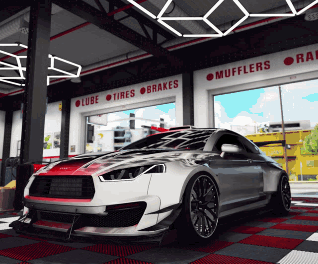 a car in a garage with a sign that says mufflers