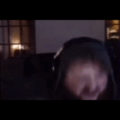a blurry picture of a man wearing headphones