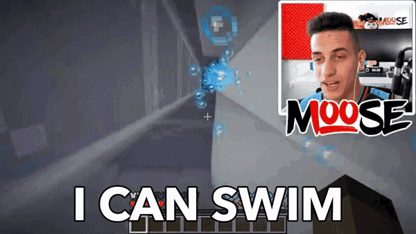 a man is playing a video game with the words " i can swim " on the bottom