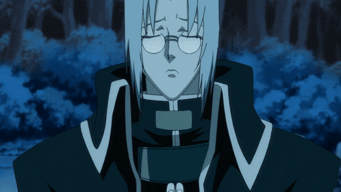 a man with glasses is praying with his hands folded in front of him