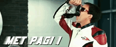 a man in a red and white jacket drinks from a bottle with the word metpagi in the background