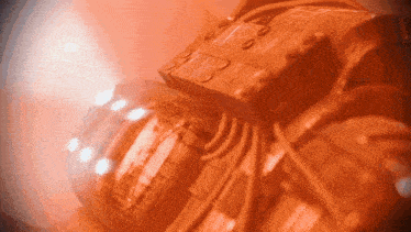 a close up of an orange object with a light shining on it