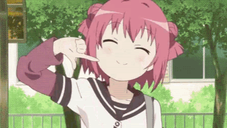 a girl with pink hair is smiling and giving a thumbs up sign .