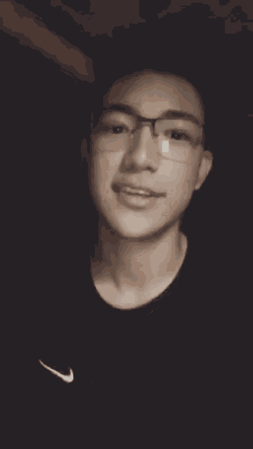 a young man wearing glasses and a black shirt says i 'm going home early