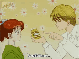a man is giving a jar of honey to a girl who is pointing at it