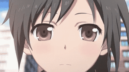 a close up of a anime girl 's face with a tear coming out of her eye .