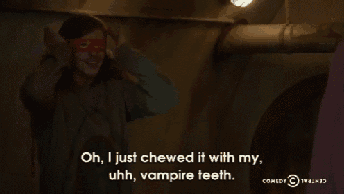 a man wearing a red mask says oh i just chewed it with my vampire teeth